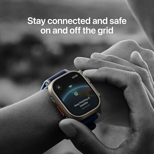 Close-up of a smartwatch on a wrist with a message about staying connected and safe.